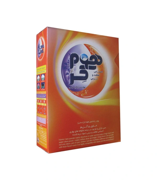 بسته پودر لباسشویی هوم کر با رایحه شکوفه‌ های بهاری، حاوی 5 آنزیم، طراحی نارنجی و بنفش با نوشته‌های فارسی و انگلیسی. 